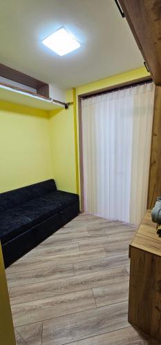 a room with a bed and a sliding door at Sayram in Yunusobod