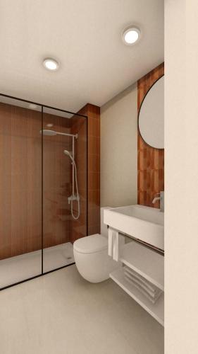 a bathroom with a shower and a toilet and a sink at CAN MATT Coliving and Residence in Tarragona