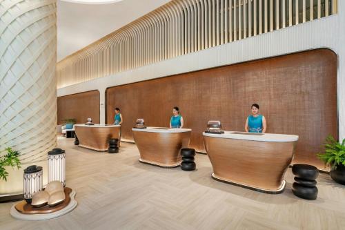 a group of people in a waiting room with tubs at Pattaya Marriott Resort and Spa in Jomtien Beach