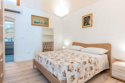 Ένα ή περισσότερα κρεβάτια σε δωμάτιο στο Casa di Armanda