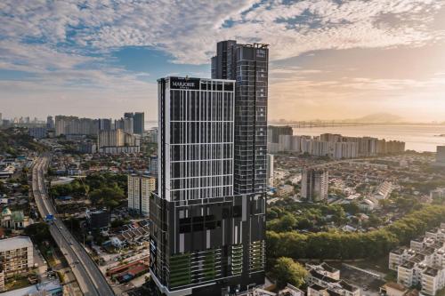 an aerial view of a tall building in a city at Iconic Marjorie Hotel, Penang, a Tribute Portfolio Hotel in Bayan Lepas