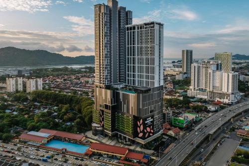 an aerial view of a tall building in a city at Iconic Marjorie Hotel, Penang, a Tribute Portfolio Hotel in Bayan Lepas