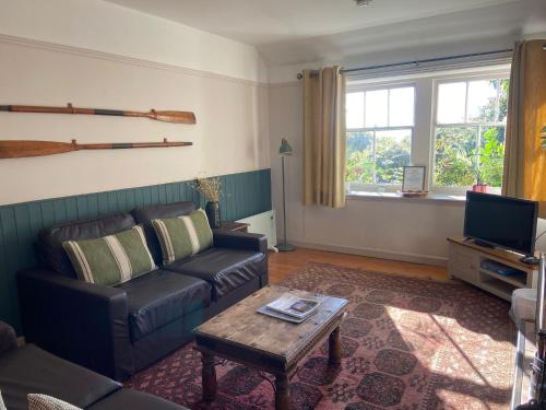 a living room with a couch and a coffee table at May Isle in Crail