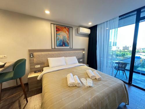 Ένα ή περισσότερα κρεβάτια σε δωμάτιο στο New Seaside Apartments Adlia street