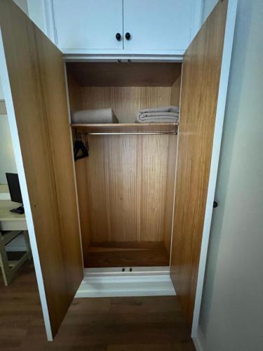 a closet with a wooden cabinet in a room at Hotel Alda Ribeira in Ribeira