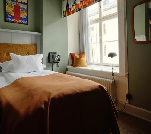 Postel nebo postele na pokoji v ubytování NOFO Hotel, WorldHotels Crafted