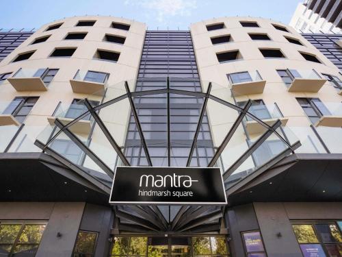 a sign in front of a building at Mantra Hindmarsh Square in Adelaide