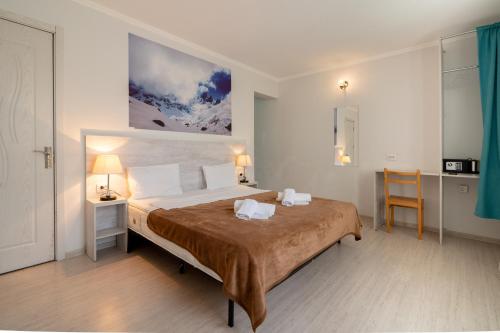 Ένα ή περισσότερα κρεβάτια σε δωμάτιο στο Tato