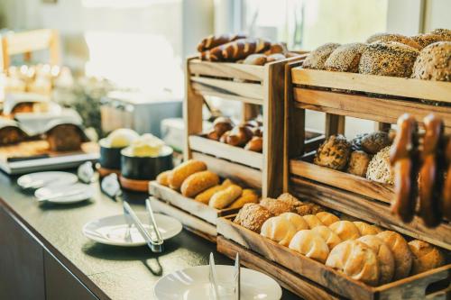 a bakery with various types of pastries on a counter at Fritz Lauterbad in Freudenstadt