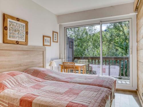 Postel nebo postele na pokoji v ubytování Appartement cosy à Megève avec balcon sud, animaux admis et parking - FR-1-453-54