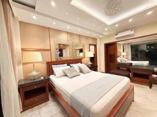 Katil atau katil-katil dalam bilik di Sol y Confort Suites
