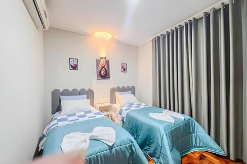 Katil atau katil-katil dalam bilik di Casa completa, 3 quartos com ar e 2 vagas