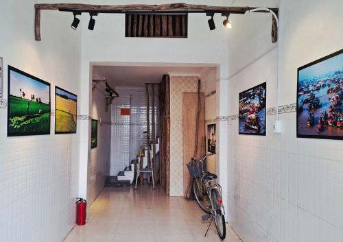 a hallway with a bike parked on the wall at Tiny house, traditional, friendly neighbour, center, sunset lake view in Can Tho