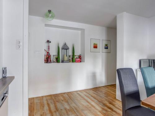 a white room with a table and a chair at Apartment Feld am See near Ski Slopes in Feld am See