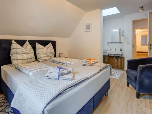 a bedroom with two beds with towels on them at Apartment Feld am See near Ski Slopes in Feld am See
