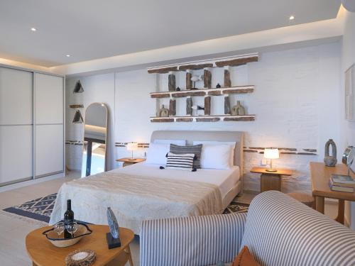 a bedroom with a bed and a living room at KEOS by the sea in Korissia