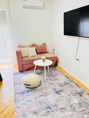 a living room with a couch and a table at Guest House Bosnian House in Sarajevo