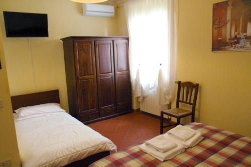 Ένα ή περισσότερα κρεβάτια σε δωμάτιο στο Agriturismo Marrucola