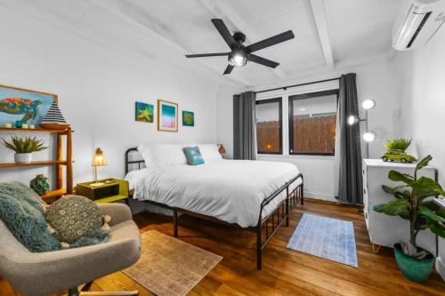 a bedroom with a bed and a ceiling fan at Luxe Beachside Escape Near Channel Islands in Hollywood Beach
