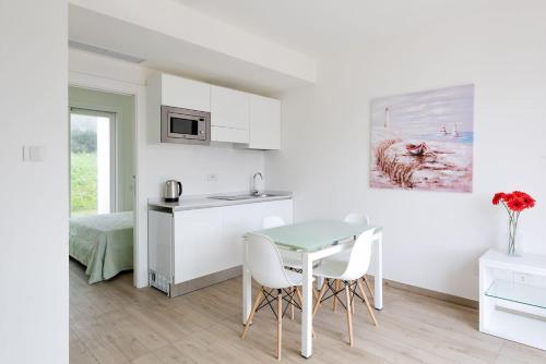 Η κουζίνα ή μικρή κουζίνα στο Stunning CapoFalcone Charming Apartment B4 sleeps4