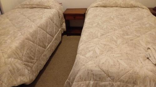 Departamento hotel quitorにあるベッド