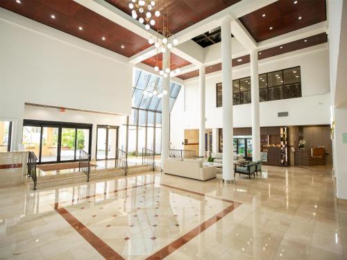 a lobby of a building with a large ceiling at Logis Auberge La Diege in Capdenac-Gare