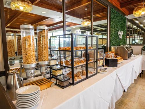 a buffet line with pastries and other food items at Logis Auberge La Diege in Capdenac-Gare