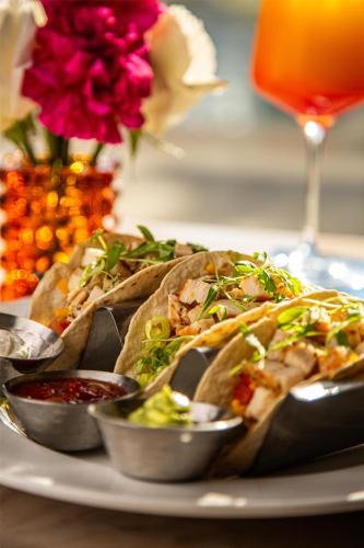 a plate of food with tacos on a table at Logis Auberge La Diege in Capdenac-Gare
