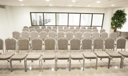 a row of chairs in a conference room at Logis Auberge La Diege in Capdenac-Gare