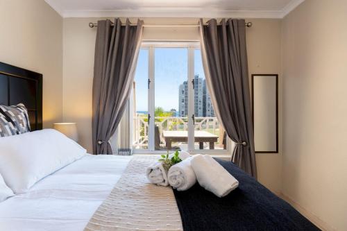 En eller flere senge i et værelse på Mont Serat 58 by CTHA