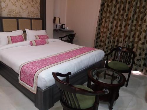 Cama o camas de una habitación en Hotel Ozas Grand