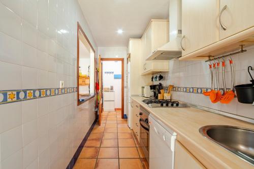 a kitchen with a sink and a counter top at Casa Nani in Zahara de los Atunes
