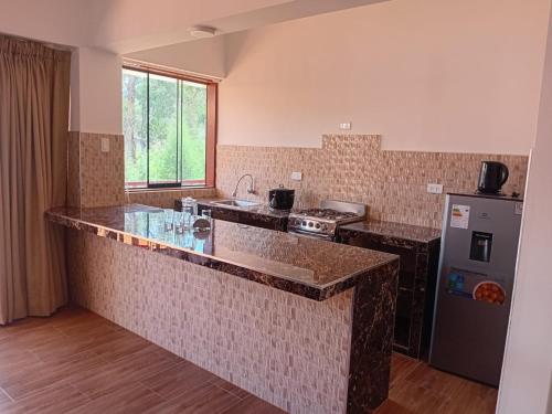 Kuchyň nebo kuchyňský kout v ubytování Rancho Mendoza casa hospedaje