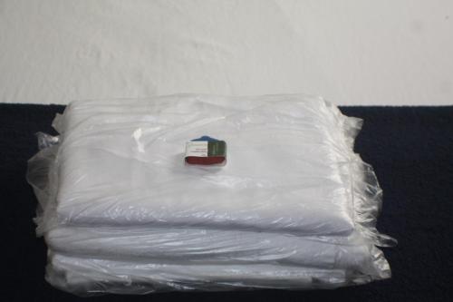 a plastic bag with a book on top of it at Farfalla Guest House in Rio de Janeiro