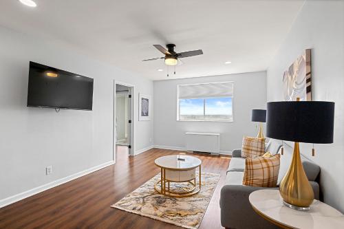 a living room with a couch and a table at Cozy Haven 2BR Condo 2207 Near Mart- Free Parking in Atlanta