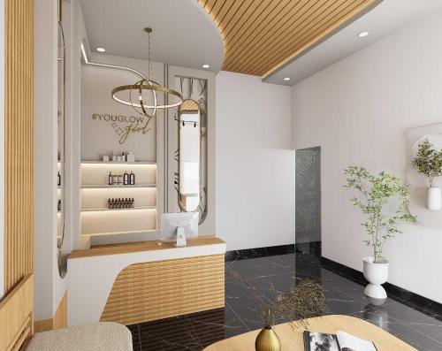 a salon with a table and a mirror at Townhouse Oak Nani Daman in Daman