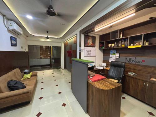 a living room with a couch and a bar in it at Townhouse Oak Nani Daman in Daman