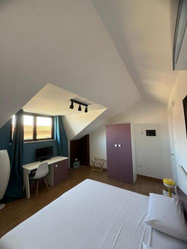 Postel nebo postele na pokoji v ubytování Matuta B&B