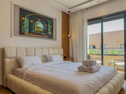 Ένα ή περισσότερα κρεβάτια σε δωμάτιο στο 26 - New apartment, great location with swimming pool