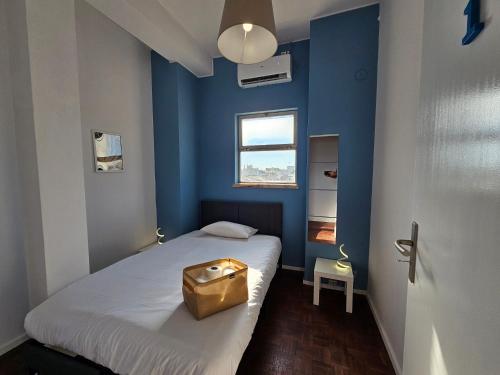 Un pat sau paturi într-o cameră la Blife Europya - private rooms at Santantonya 3rd floor