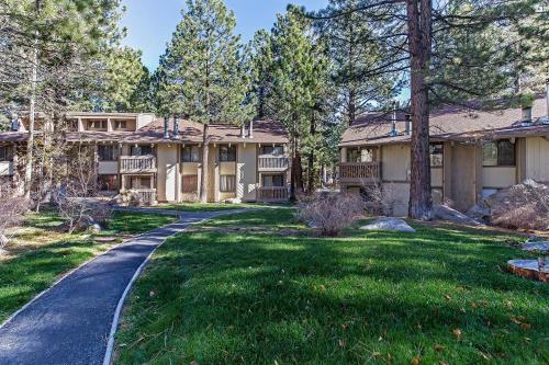 a house with a driveway in front of a yard at Horizons 4 - Pool & Hot Tub Access in Mammoth Lakes