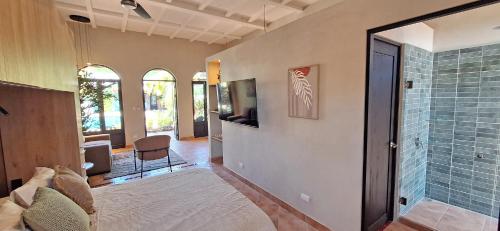 a room with a shower and a glass door at Club Heasa - Men Only in La Garita