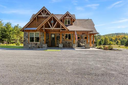 a house with a large driveway in front of it at Nesting in North Creek in North Creek