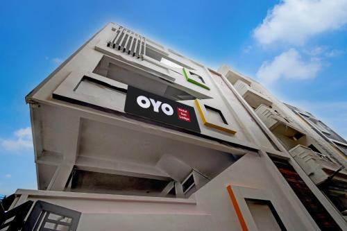 a building with an ovo sign on the side of it at Hotel O Sun Lodge in Hyderabad