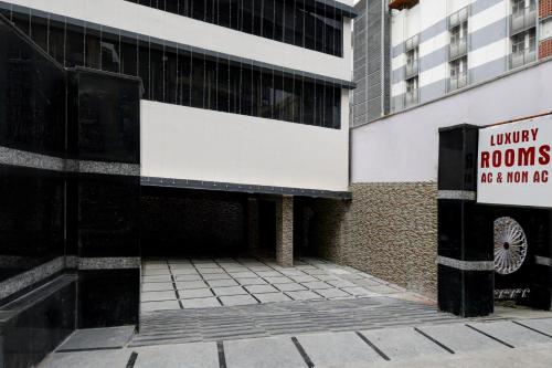 a building with a sign on the side of it at Hotel O P R S Elite in Surūrnagar