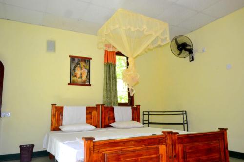 Postel nebo postele na pokoji v ubytování Sigiriya Freedom Lodge