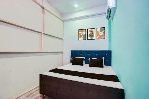 Ένα ή περισσότερα κρεβάτια σε δωμάτιο στο Hotel O Ayush Hotel & Restaurant