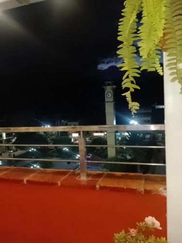 a view of a clock tower from a balcony at Chanka Suites in Talavera