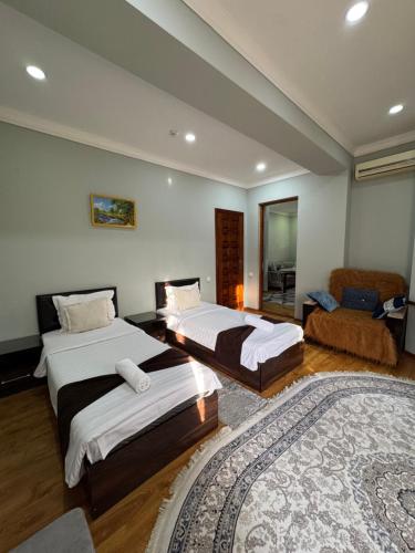 Кровать или кровати в номере Shuxrat hotel