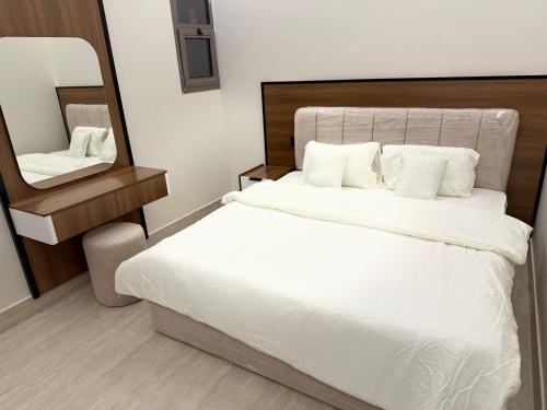 Postel nebo postele na pokoji v ubytování شقه مميزه و أجمل تصميم